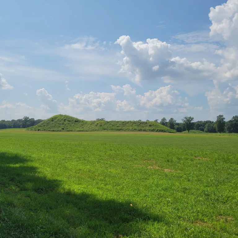 Main platform mound at Angel Mounds State Historic Site in Indiana, with a smaller mound visible in the distance across the open plaza.