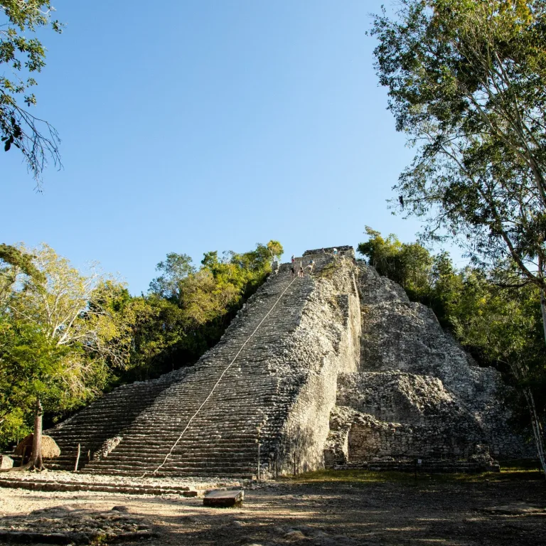 Nohoch Mul Pyramid at Cobá, the tallest Maya pyramid in the Yucatán, rising above the jungle with steep stone steps