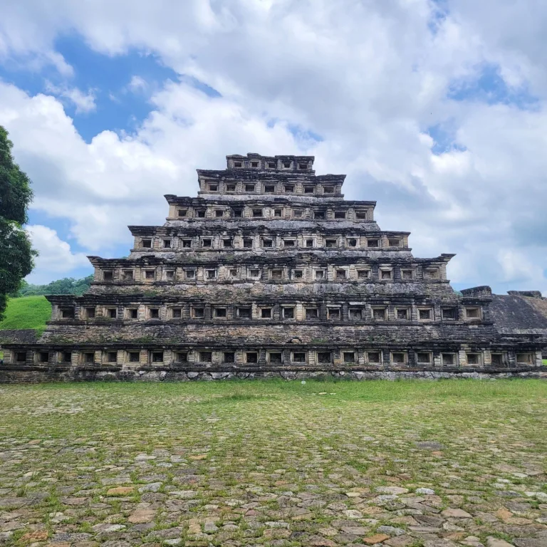 Full rear view of the Pyramid of the Niches at El Tajín with its 365 stone recesses clearly visible