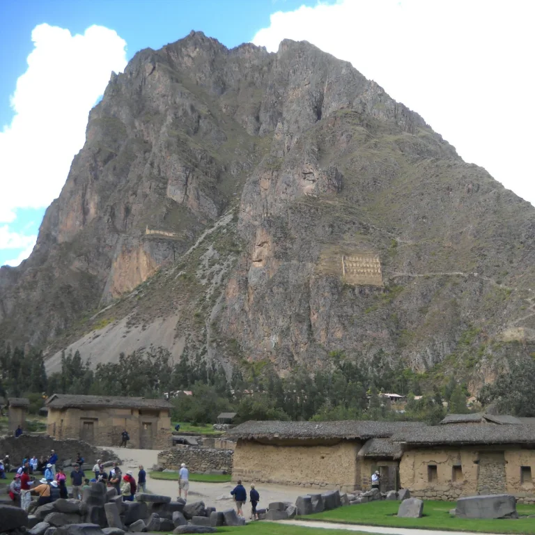 View of Pinkuylluna Hill across from Ollantaytambo, showing Inca granaries built high into the mountainside.