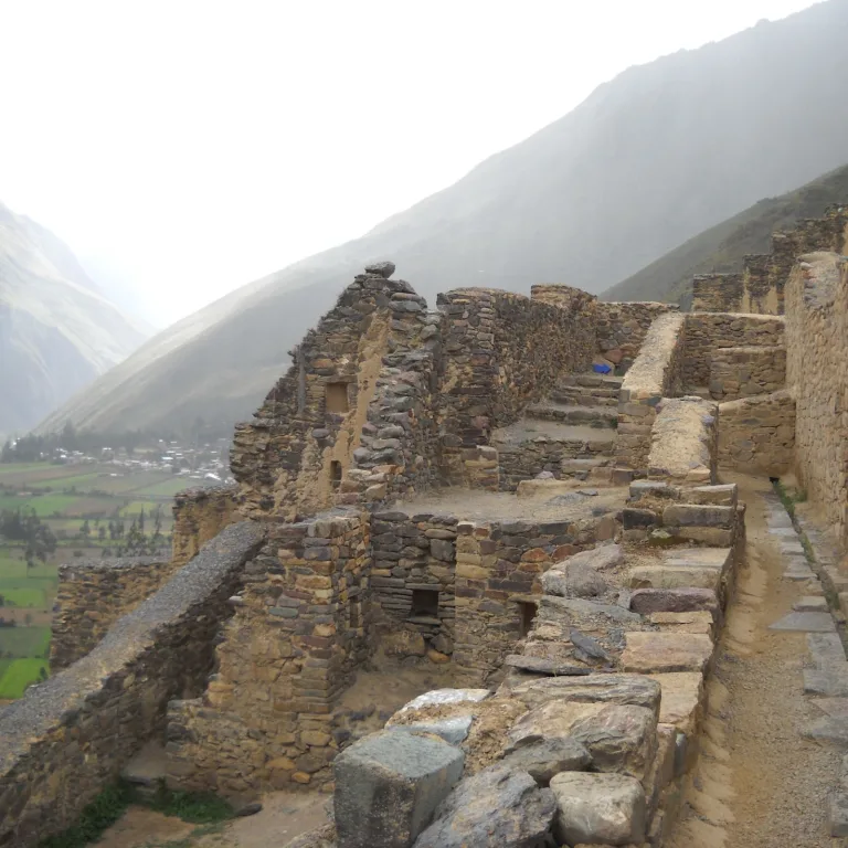 Stone walls and structures overlooking the Sacred Valley from the upper ruins of Ollantaytambo.