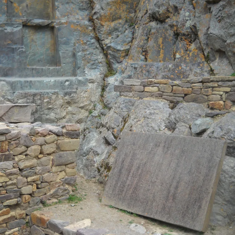 Close-up of finely carved granite blocks and unfinished stones at Ollantaytambo’s Temple of the Sun area.