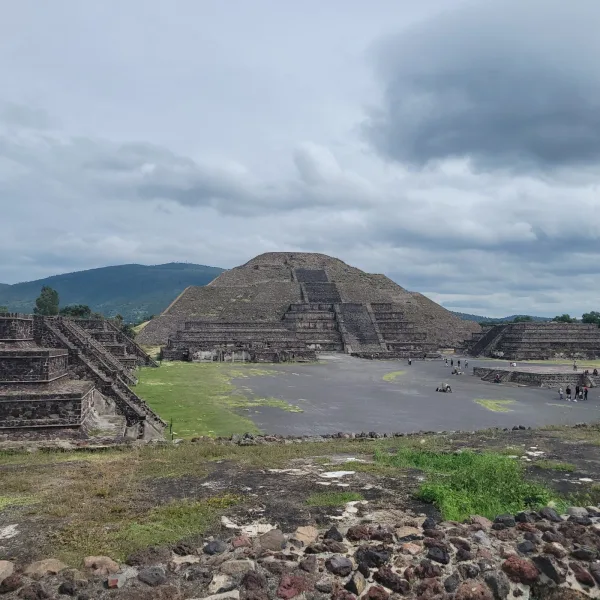 Wide-angle view of the Pyramid of the Moon at Teotihuacan surrounded by stepped platforms and ceremonial plazas.