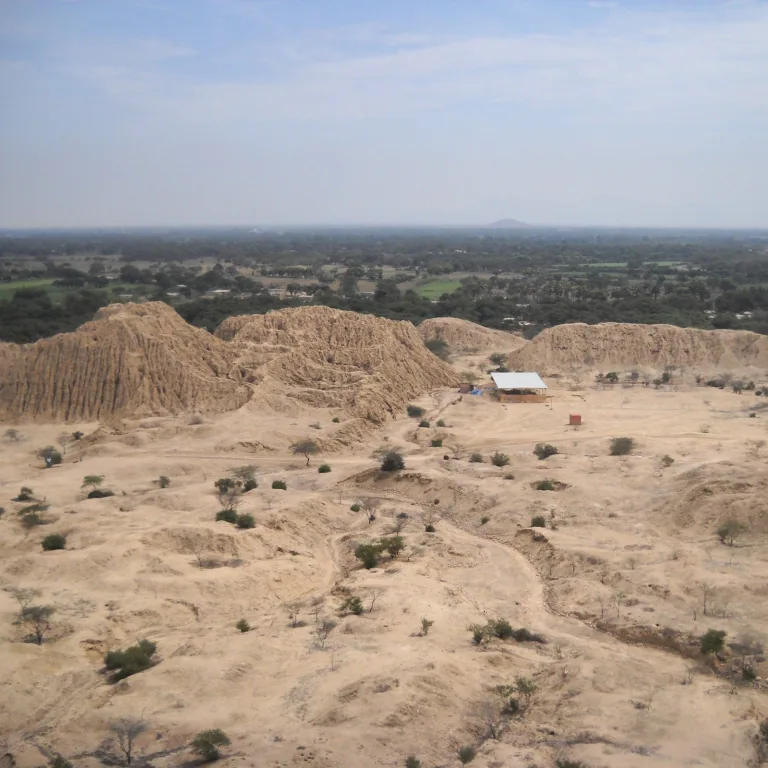 Panoramic view from Cerro Purgatorio showing the adobe pyramids of Túcume and surrounding valley landscape in northern Peru