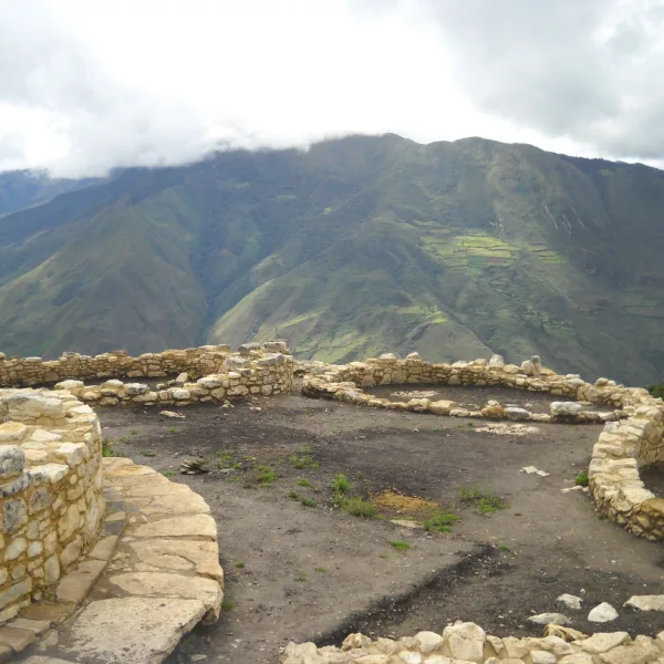 Circular stone dwellings at Kuelap, Chachapoya fortress in northern Peru, overlooking the Andes mountains.
