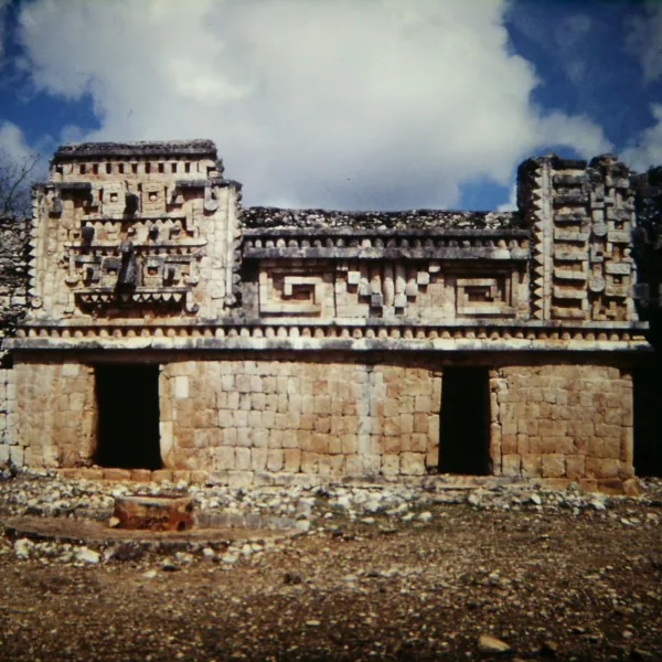 Front view of the main palace at Xlapak with well-preserved Puuc-style stone mosaic and Chaac masks