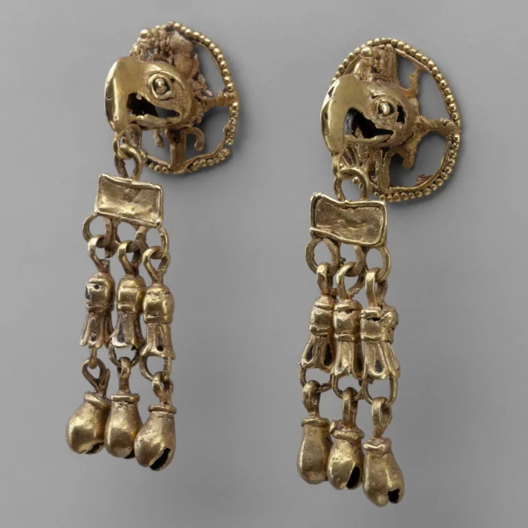 Aztec gold ornaments featuring the detailed form of the sacred eagle, linked to the sun and the founding of Tenochtitlan.