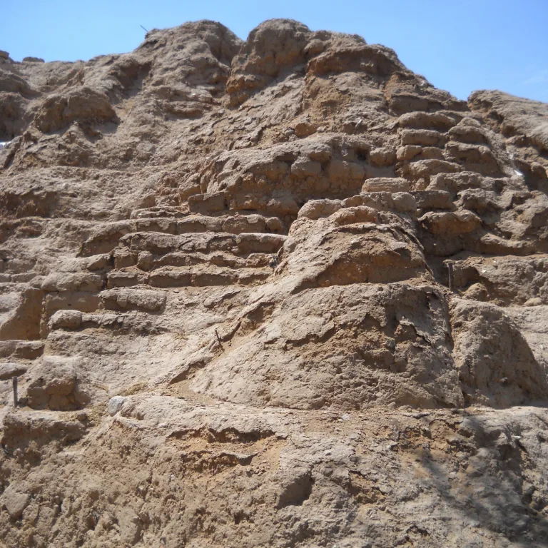 Close-up of stepped adobe brick construction at Huaca Rajada in Sipán, Lambayeque, Peru, part of the Moche ceremonial pyramid complex
