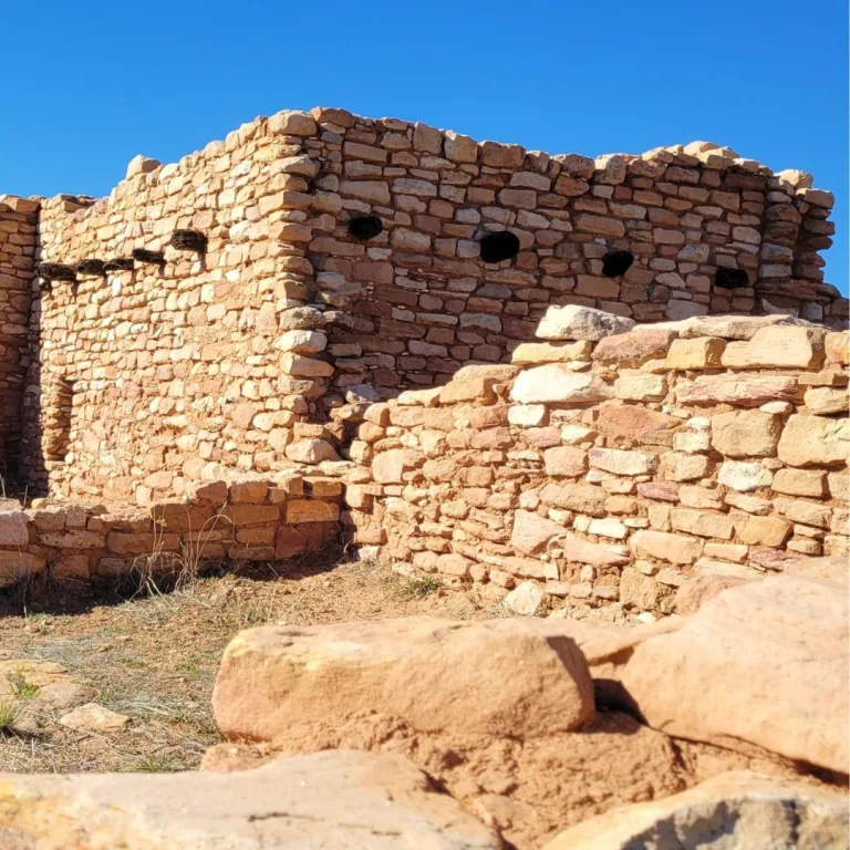Ancestral Puebloan stone room blocks and slab built walls at Edge of the Cedars, showing stacked sandstone masonry and compact residential architecture.