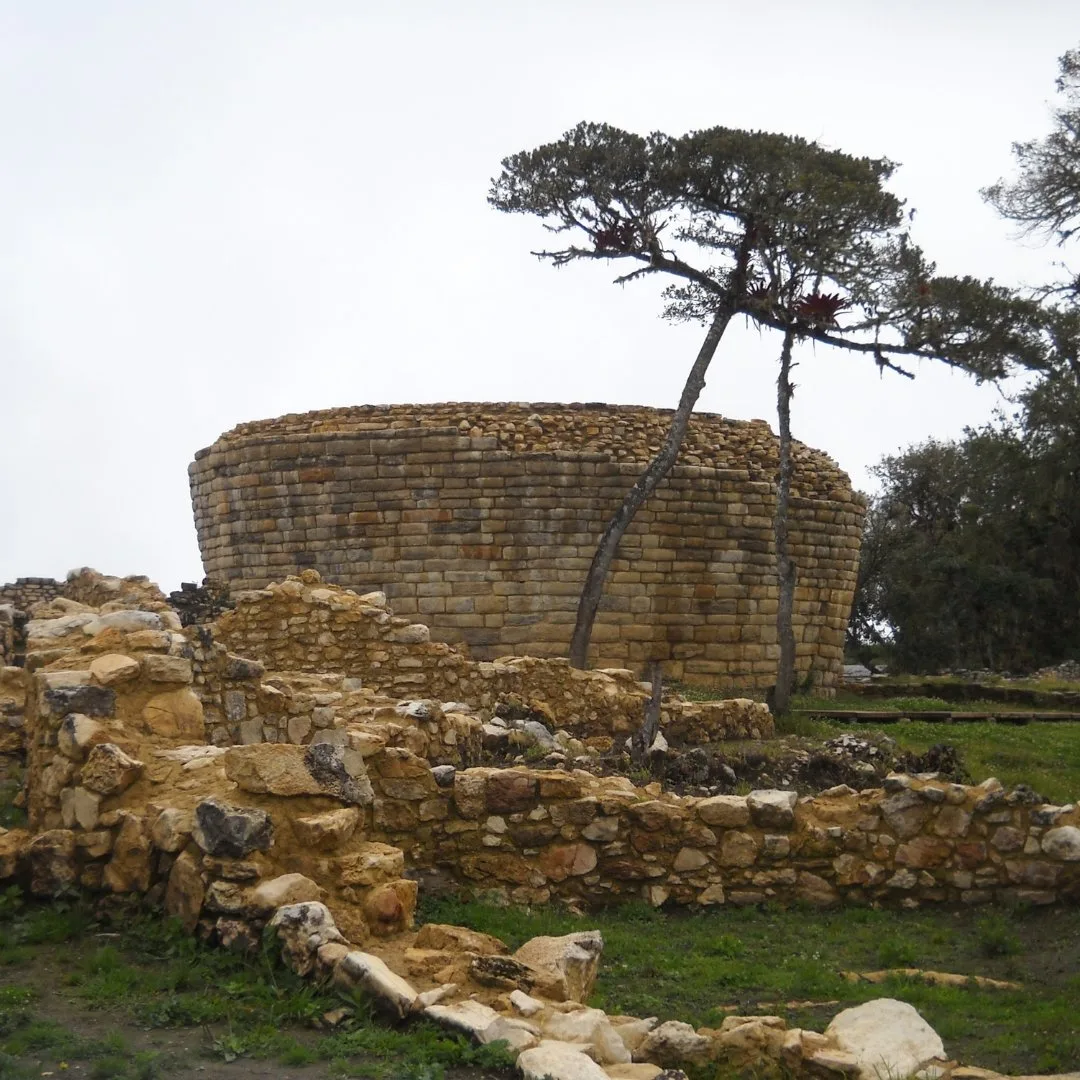 Inverted-Cone Structure El Tintero at Kuélap in Chachapoyas, Peru, with surrounding stone ruins and trees.