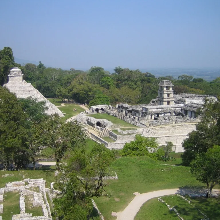 Overview of Palenque in Chiapas, Mexico, showing the Temple of the Inscriptions and the Palace above the surrounding jungle.