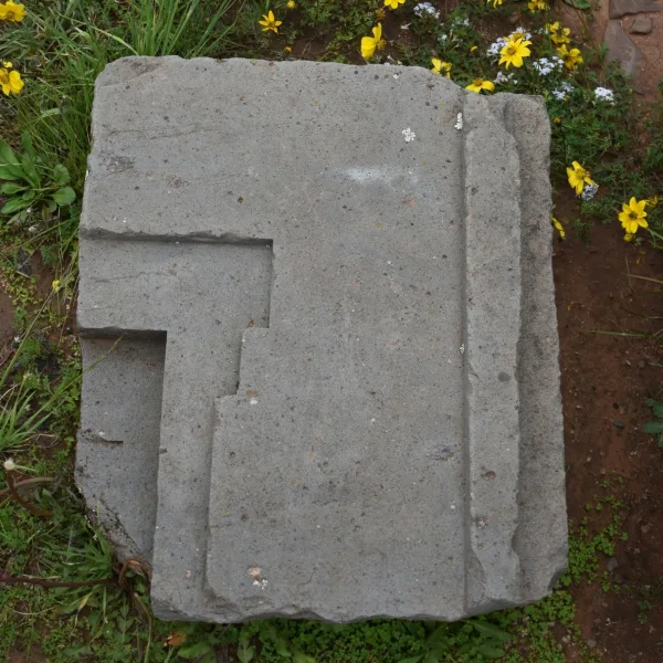 Carved stone block at Tiwanaku in Bolivia showing the precisely cut stonework associated with Tiwanaku architecture.