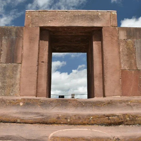 Close view of the Kalasasaya doorway at Tiwanaku in Bolivia with a monolith visible through the opening.