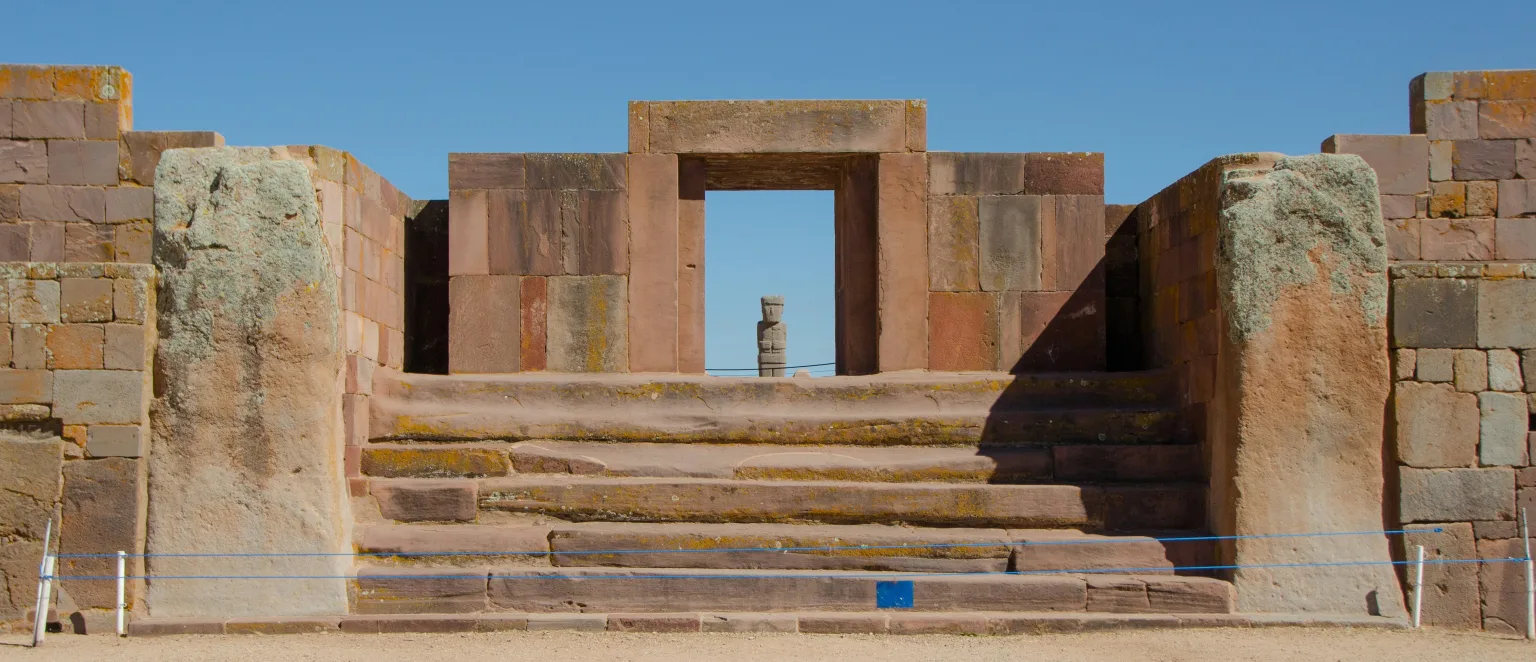 Wide view of the Kalasasaya doorway at Tiwanaku in Bolivia with the Ponce monolith framed in the opening.
