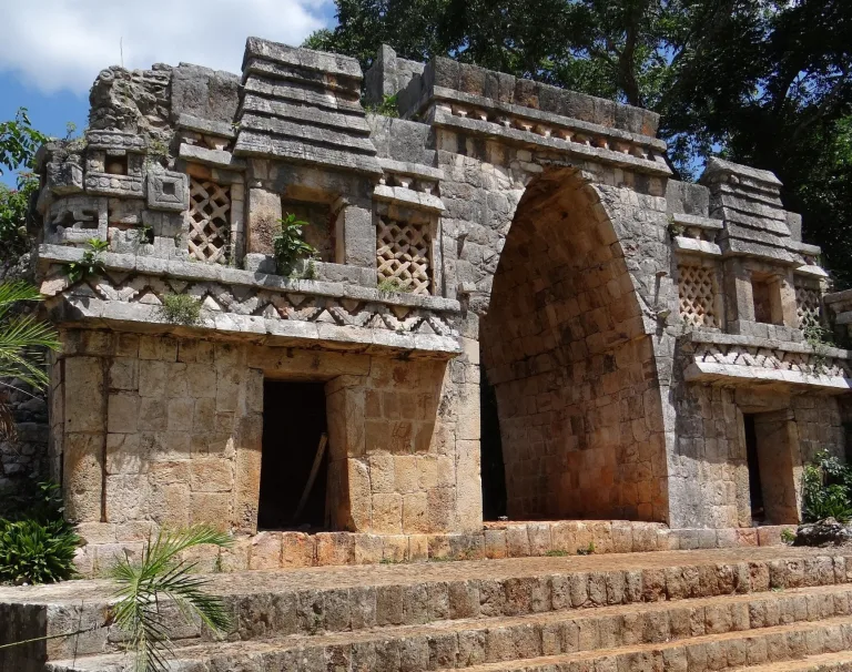 Labná Arch at the Maya site of Labná on the Puuc Route in Yucatán, Mexico, with a corbel arch, lattice stone panels, and carved Puuc-style facade details.