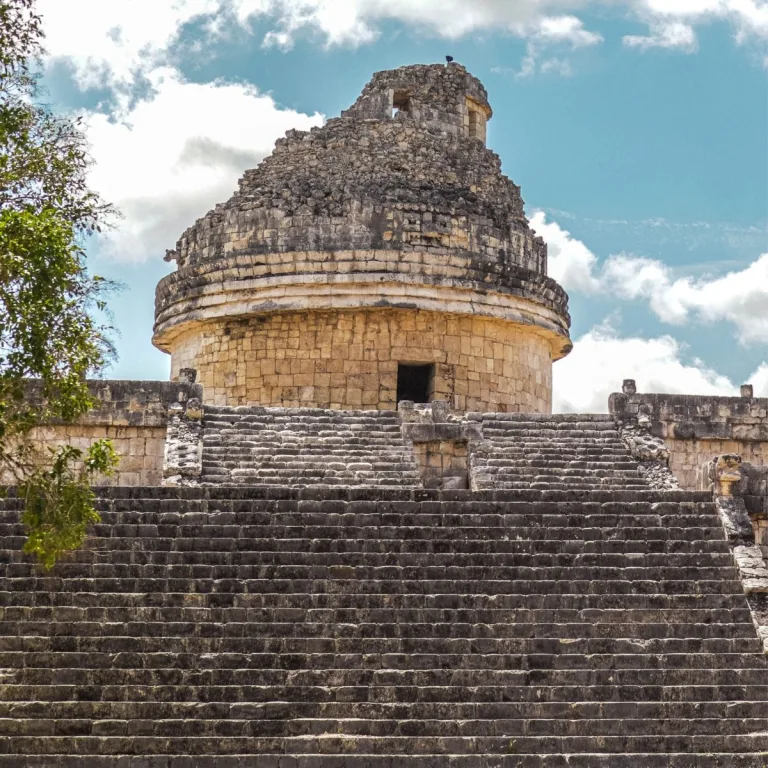 El Caracol at Chichén Itzá in Yucatán, Mexico, showing the circular observatory tower above a broad stone staircase and stepped platform.