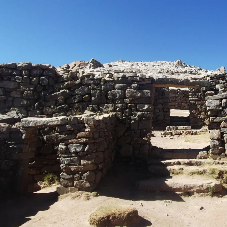 Connected stone doorways and narrow passages inside the Inca Chincanna labyrinth on Isla del Sol, Bolivia.