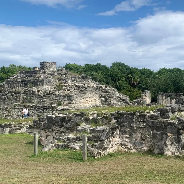 Structure 2 rises behind low masonry foundations at the Maya archaeological site of El Rey in Cancún, Quintana Roo, Mexico.