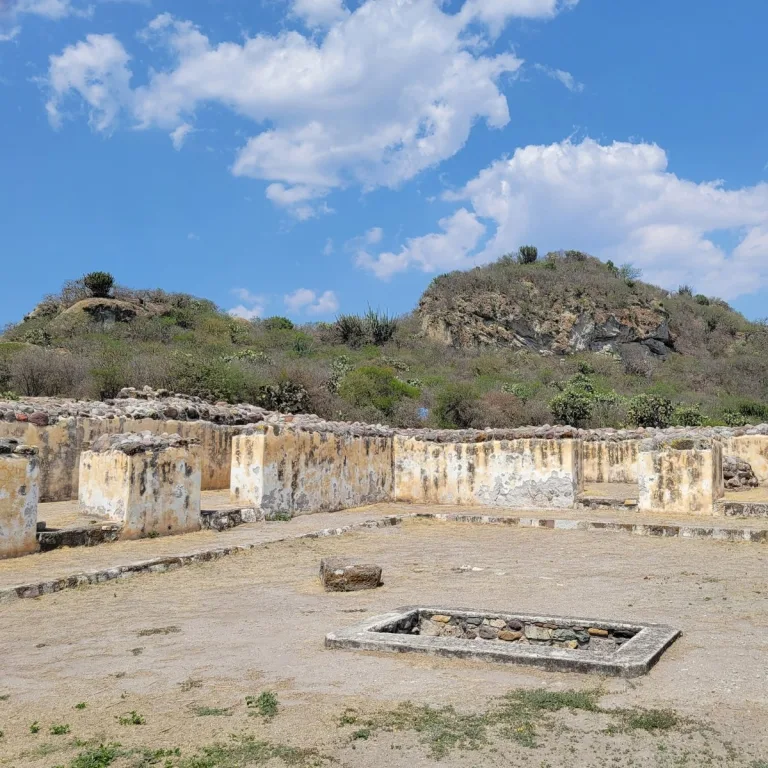 Palace of the Six Patios at Yagul in Oaxaca, Mexico, showing plastered Zapotec rooms, stone walls, and an entrance to one of the courtyard tombs.