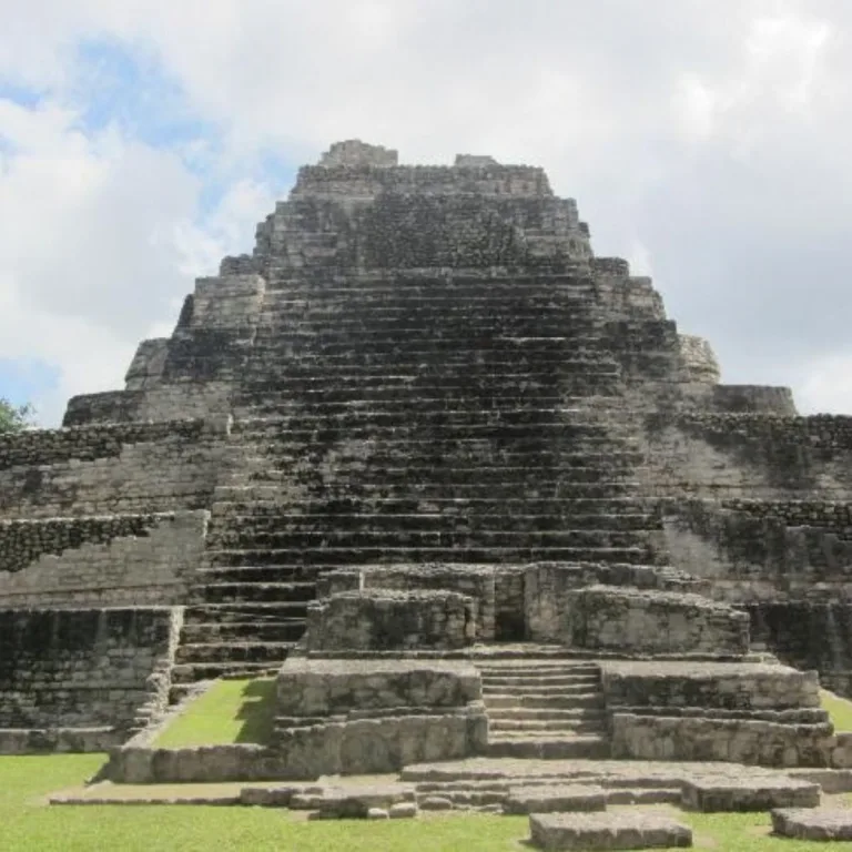 Temple 1 at Chacchoben in Quintana Roo, Mexico, with its broad central staircase rising through six stepped levels on the Gran Basamento.