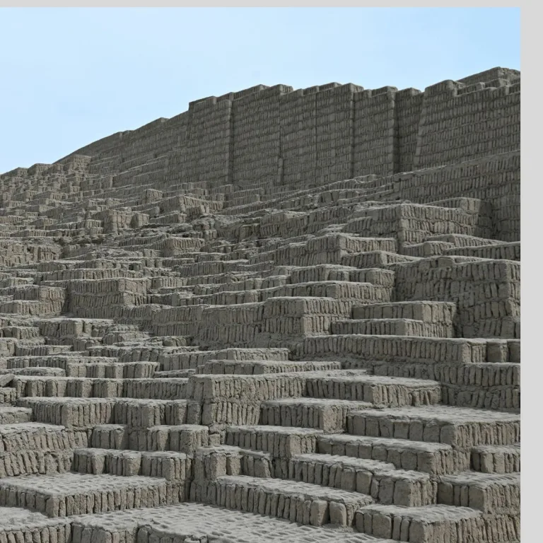 Close view of the Gran Pirámide at Huaca Pucllana in Lima, Peru, showing densely arranged vertical adobe bricks forming stepped terraces and monumental retaining walls.