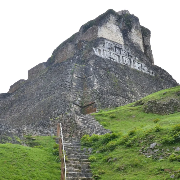 West side of El Castillo at Xunantunich in Cayo District, Belize, showing the surviving Maya stucco frieze high on Structure A-6.